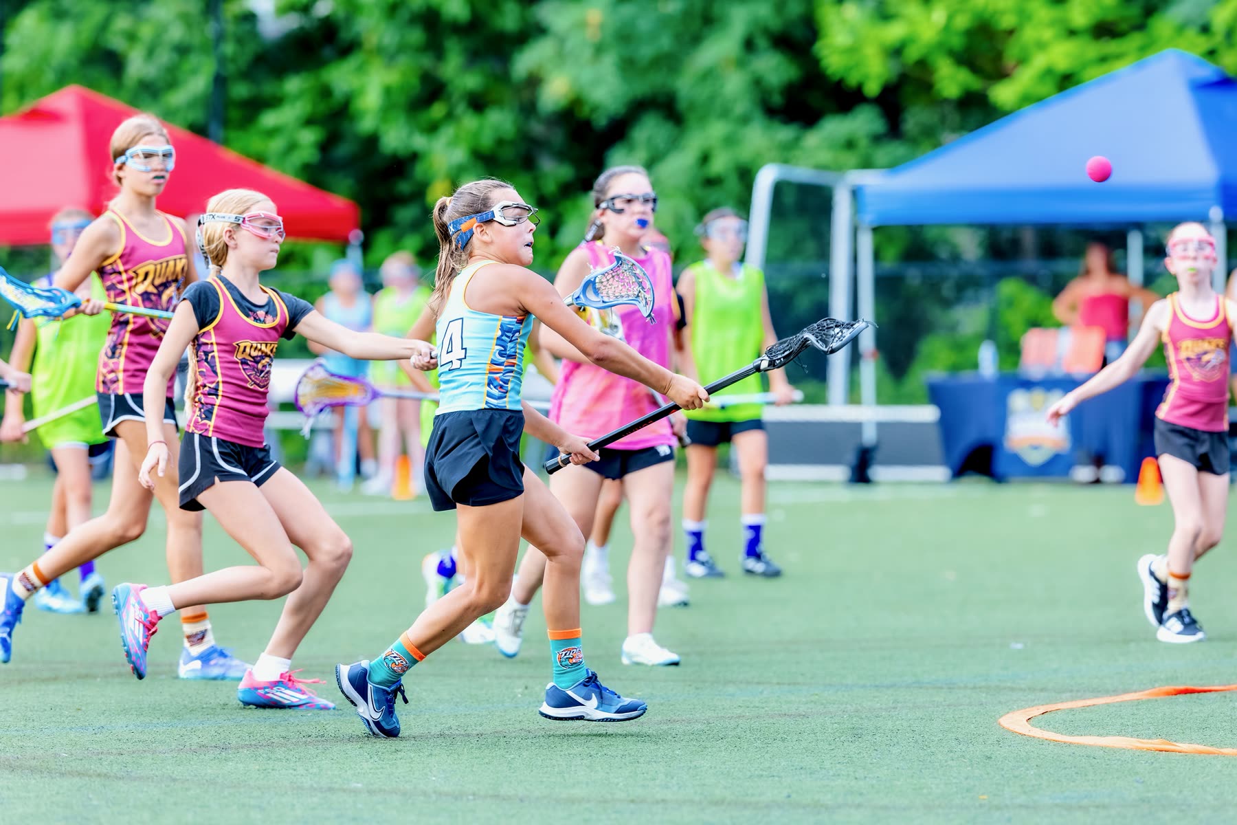 Youth lacrosse group training on a field in Cranford, NJ